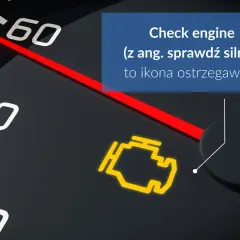 Żółta kontrolka check engine na desce rozdzielczej, ostrzegająca o problemach z silnikiem.