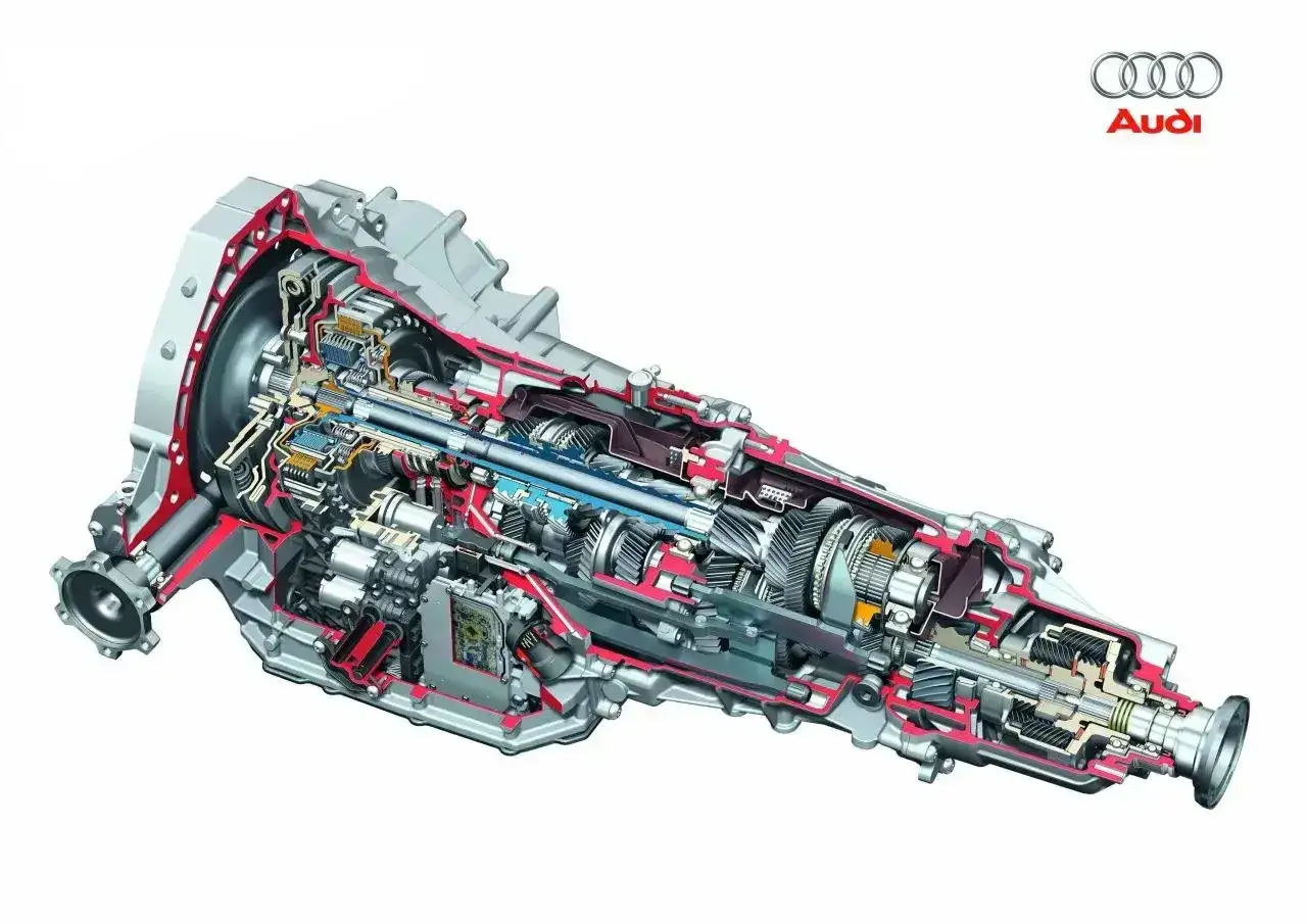 Przekrój skrzyni biegów Audi DSG, ukazujący złożony mechanizm z wieloma zębatkami i elementami hydraulicznymi.